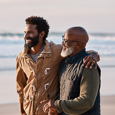 dad and son at the beach